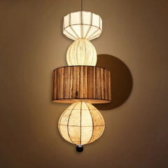 Decorative pendant lamp with wooden and fabric shades on a beige background