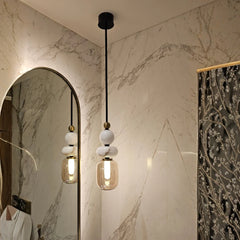 Unique pendant light fixture hanging in a corner of a room.