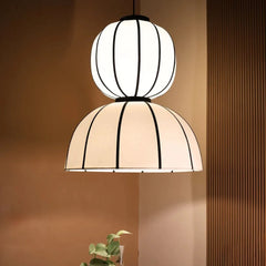 Two-layered pendant lamp featuring off-white poplin fabric shade with black accent suspension – poetic blend of shadow and glow