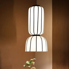 Modern pendant light with off-white poplin fabric shade, black suspension detail