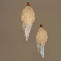Two feathered shade pendant lights hanging against a plain background