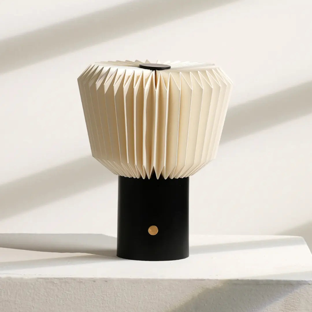 Bouquet Table Lamp with a unique design made from folded paper on a black base, set against a neutral background.
