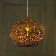 Clay Natural-Rope & Banana-Bark Pendant Light hanging against a dark green wall