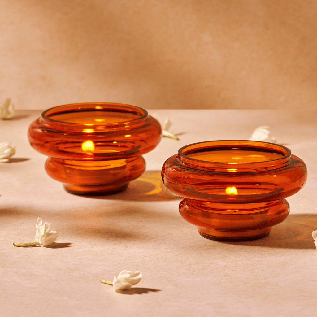 amber glass diya-inspired votive with tea light