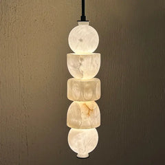 Stacked marble pendant light against a neutral background