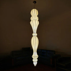 Decorative pendant light fixture in a dark room