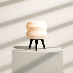 Unique Echo Lamp with a geometric design and black stand on a light background