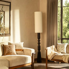 Wooden Orin Floor Lamp styled in a living room setting
