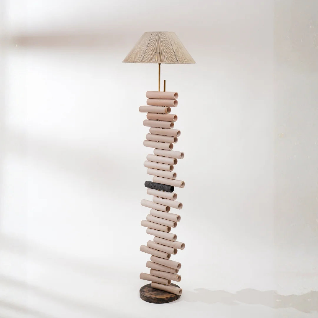 Chord 180 D Floor Lamp full view made of stacked cylindrical wooden pieces 