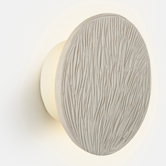 Terracotta clay disc wall light mounted on wall