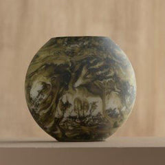Decorative Bella Green Vase with artistic design on a beige background