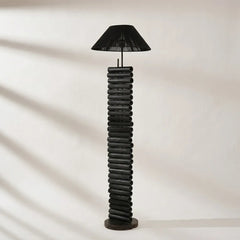Black spiral floor lamp on a neutral background