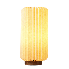 Decorative Serenity Table Lamp with a textured linen shade and a mango wood base, glowing warm light