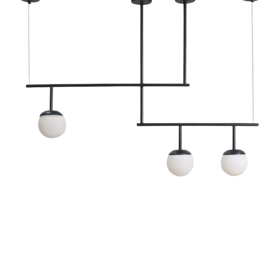 A modern minimalist chandelier with a black metal structure and frosted glass shades.