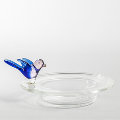 Glass tea light holder with intricately detailed bird design on the circular surfaces