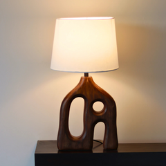 Orion Wooden Table Lamp with wooden base and white shade showing warm ambient glow