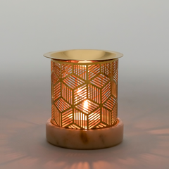 Decorative candle holder with geometric pattern on a neutral background