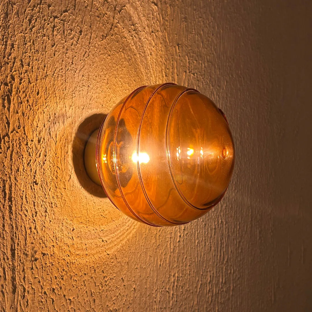 Amber glass Spiral Wall Light, with warm ambient lighting