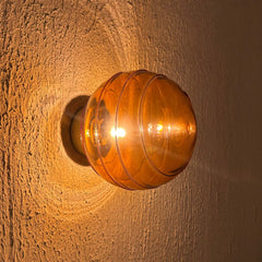 Amber glass Spiral Wall Light, with warm ambient lighting