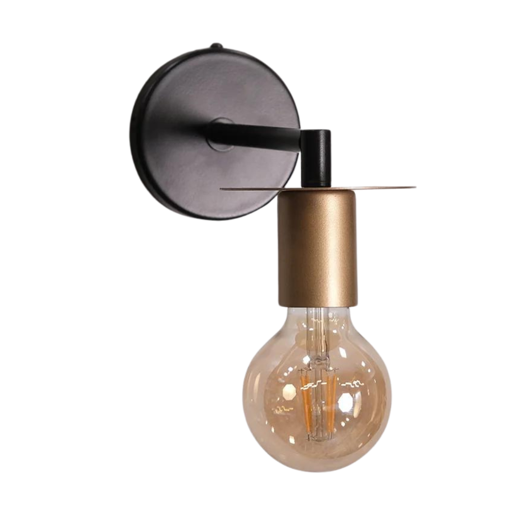 A modern industrial wall light with a sleek black arm and round base, featuring a golden socket and an exposed filament bulb.