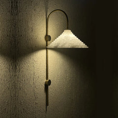 Conical Wall-mounted lamp with a textured white shade and gold fixture 