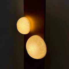 Close-up of hand-carved alabaster globes on the designer Arc floor lamp
