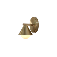 A single Cone Wall Sconce with brass material, displaying a modern and contemporary style, illuminated in a dark setting.