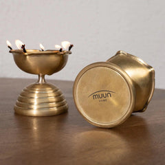 Brass Diya Gift Set by Muun Homes, branding at the bottom of the diya