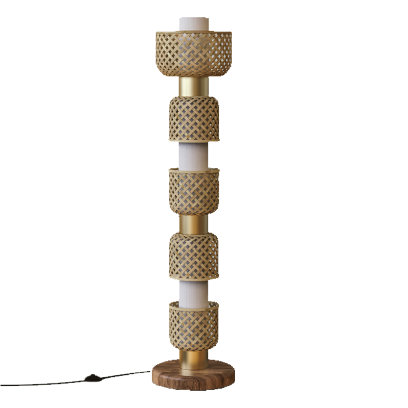 A floor lamp with a bamboo shade, brass finish on the center column, and a wood base.