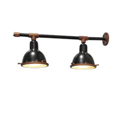 A wall-mounted bar and cafe light fixture in black and copper colors with dual lampshades.