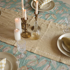 Mirage Sand Linen Table Runner with pillar candles and decanter, top view