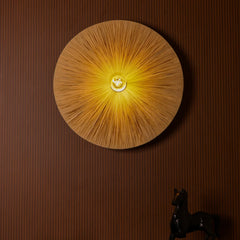 Unique Vagu wall lamp with metal frame and natural raffia in circular design casting warm ambient light