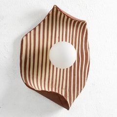 Ceramic Hexagonal wall lamp with brown and white striped pattern on a white background