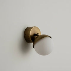 Brass Fly Wall Sconce Small with a white glass shade on a light gray background