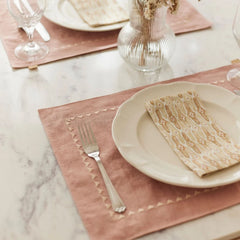 Mosaic Sand Cotton Table Napkin on plate at marble table setting, angled view