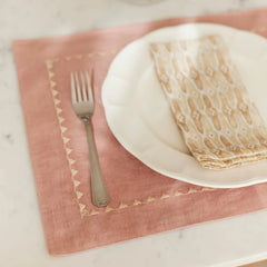 Mosaic Sand Cotton Table Napkin on scalloped plate with fork, close view