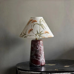 Florence Table Lamp - Styled on Dark Marble Side Table Against Grey Wall