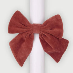 Rhubarb Velvet Napkin Ring, single micro-velvet bow on white rolled napkin, front view