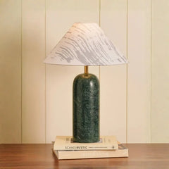 Plinth Table Lamp - Front View, Cylindrical Green Marble Base Against Panelled Wall