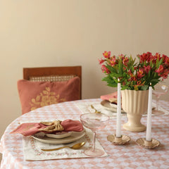 Sand Velvet Napkin Rings on pink napkin at dining table with red flowers and candles