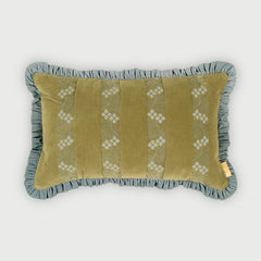 A rectangular decorative throw pillow with a ruffled border, featuring a muted olive green center panel with vertical white embroidered floral patterns and a dusty blue-gray ruffled trim, shown against a light gray background.