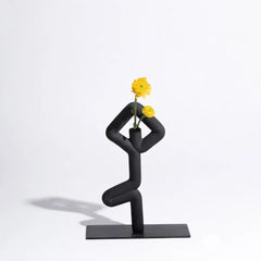 Abstract black vase shaped as a Vrikshasana yoga posture