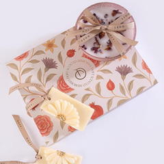 Scented Memories Wax Tablet & Bowl Candle · Gift Set of 2, ribbon-tied bowl candle and daisy wax tablet on floral box, top view