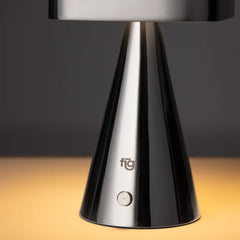 Chrome table lamp with 'figo' branding on a dark background