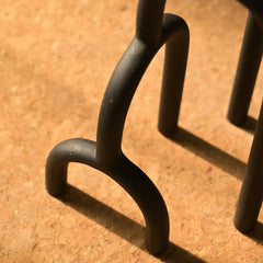 Close-up of a black metal Aria Decor Sculpture
