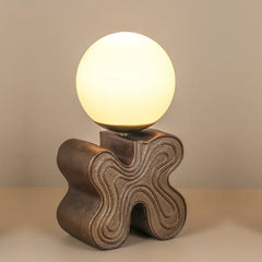 Decorative Eton Table Lamp, made of aluminum base, finished in antique brass with smooth glass globe diffuses soft light