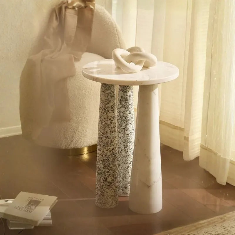 Illr Side Table - Round White Marble Top with Speckled Granite Legs Beside Boucle Chair