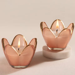 Eternal Bloom - Votive Candle - Pink - English Rose - Set of 2, lit pink glass votives with gold edging, one on marble riser