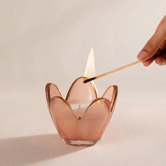 Eternal Bloom - Votive Candle - Pink - English Rose - Set of 2, hand lighting a pink tulip-shaped votive with a match