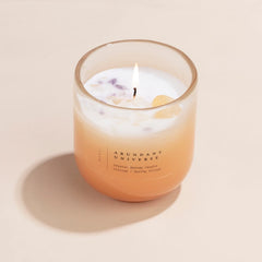 Amethyst & Citrine Candles - Crystal Energy - Set of 2, lit Abundant Universe citrus ombre glass candle, front view